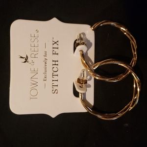 Gold tone intertwined hoop earrings